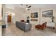 Cozy living room showcasing access to the front door and an electric fireplace feature at 3842 W Ironwood Dr, Chandler, AZ 85226
