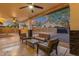 Charming covered patio with comfortable seating and stone accents, perfect for outdoor relaxation at 3842 W Ironwood Dr, Chandler, AZ 85226