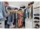 This walk-in closet features ample shelving and hanging space with built in drawers for organization and storage at 3842 W Ironwood Dr, Chandler, AZ 85226