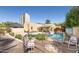 Expansive backyard featuring a pool, patio area, and well-maintained landscaping at 39 E Hoover Ave, Phoenix, AZ 85004