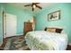 Bright bedroom with a ceiling fan, a window letting in natural light, and a dresser with ample drawer space at 39 E Hoover Ave, Phoenix, AZ 85004