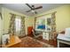Bedroom with hardwood floors, ceiling fan, and two windows with natural light at 39 E Hoover Ave, Phoenix, AZ 85004