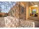 Wrought iron gate leading to a home's courtyard with seating, offering a serene and private outdoor space at 39 E Hoover Ave, Phoenix, AZ 85004