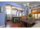 Charming dining area connected to the kitchen, with a wooden table and chandelier above at 39 E Hoover Ave, Phoenix, AZ 85004