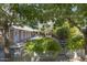 Charming outdoor space with lush greenery, rustic planters, and a cozy dining area at 39 E Hoover Ave, Phoenix, AZ 85004