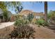 Charming single-story home featuring desert landscaping, a clay tile roof, and turquoise window trim at 39 E Hoover Ave, Phoenix, AZ 85004