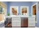 Kitchen counter featuring a wine cooler, stainless steel dishwasher, and white cabinetry at 39 E Hoover Ave, Phoenix, AZ 85004
