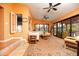 Spacious living room with a seating area, decorative rugs, and glass doors leading to outdoor spaces at 39 E Hoover Ave, Phoenix, AZ 85004