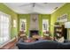 Spacious living room showcasing a fireplace, hardwood floors, and comfortable seating arrangements at 39 E Hoover Ave, Phoenix, AZ 85004