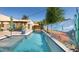 Refreshing pool area featuring a desert-themed mural, outdoor dining, and serene ambiance at 39 E Hoover Ave, Phoenix, AZ 85004