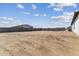 Large backyard with block wall, offering privacy and space for outdoor activities and future landscaping at 3989 E Freeman Ln, San Tan Valley, AZ 85140