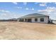 Large backyard offering space for outdoor activities with a contemporary-style home in the background at 3989 E Freeman Ln, San Tan Valley, AZ 85140