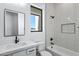 Modern bathroom featuring subway tiles, black fixtures, soaking tub and natural light at 3989 E Freeman Ln, San Tan Valley, AZ 85140
