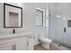 Modern bathroom with white vanity, sleek fixtures, and a glass-enclosed shower for a clean and stylish design at 3989 E Freeman Ln, San Tan Valley, AZ 85140