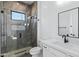 Elegant bathroom showcasing a glass-enclosed shower, tiled walls, and modern fixtures at 3989 E Freeman Ln, San Tan Valley, AZ 85140
