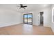 Expansive bedroom featuring wood flooring, patio access, and an ensuite bathroom at 3989 E Freeman Ln, San Tan Valley, AZ 85140