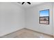 A simple bedroom design with a window offering outdoor views and carpeted floors at 3989 E Freeman Ln, San Tan Valley, AZ 85140