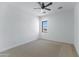 Bedroom with neutral carpet, window, ceiling fan, and white walls at 3989 E Freeman Ln, San Tan Valley, AZ 85140