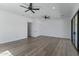 Spacious bedroom with hardwood floors, ceiling fans, and access to a walk-in closet at 3989 E Freeman Ln, San Tan Valley, AZ 85140