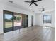 Bedroom with hard floors, ceiling fan and backyard access through a sliding glass door at 3989 E Freeman Ln, San Tan Valley, AZ 85140
