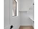 Bright closet with white shelving and a small window for natural light at 3989 E Freeman Ln, San Tan Valley, AZ 85140