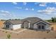 Beautiful single-story home featuring modern architecture, complemented by gravel landscaping and a serene blue sky at 3989 E Freeman Ln, San Tan Valley, AZ 85140