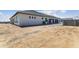 Home exterior featuring a three-car garage and plenty of room for additional parking on the driveway at 3989 E Freeman Ln, San Tan Valley, AZ 85140