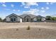 Charming one-story home featuring stone accents, low-maintenance landscaping, and a circular driveway at 3989 E Freeman Ln, San Tan Valley, AZ 85140