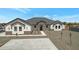 Beautiful single-story home featuring a modern design, manicured landscaping and a paved driveway at 3989 E Freeman Ln, San Tan Valley, AZ 85140