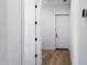 Hallway with wood floors and white doors at 3989 E Freeman Ln, San Tan Valley, AZ 85140