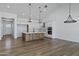 Modern kitchen featuring an island, white cabinets, stainless steel appliances, and sleek countertops at 3989 E Freeman Ln, San Tan Valley, AZ 85140