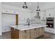 Contemporary kitchen with a large island, stainless steel appliances, and ample counter space at 3989 E Freeman Ln, San Tan Valley, AZ 85140