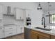 Kitchen featuring stainless steel appliances, a stylish range hood, and a functional layout at 3989 E Freeman Ln, San Tan Valley, AZ 85140