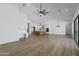 Spacious living room with high ceilings, hardwood floors, and ample natural light from large sliding doors at 3989 E Freeman Ln, San Tan Valley, AZ 85140