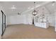 Open concept living space with vaulted ceilings, modern light fixtures, and neutral colors throughout at 3989 E Freeman Ln, San Tan Valley, AZ 85140