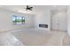 Bright bedroom with a modern fireplace, ceiling fan, and large windows offering natural light at 3989 E Freeman Ln, San Tan Valley, AZ 85140
