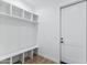 Mud room featuring built in shelving, bench seating, and wood flooring at 3989 E Freeman Ln, San Tan Valley, AZ 85140