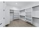 Bright walk-in closet with built-in shelving and carpet floors at 3989 E Freeman Ln, San Tan Valley, AZ 85140