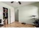 Spacious bedroom features a ceiling fan and closet for storing belongings at 40264 W Lococo St, Maricopa, AZ 85138