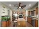 Functional kitchen featuring stainless steel appliances, kitchen island, and a fish tank at 40264 W Lococo St, Maricopa, AZ 85138