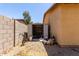 Metal shed near the house, surrounded by a block wall and gravel at 40264 W Lococo St, Maricopa, AZ 85138