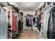Spacious walk-in closet with ample storage space and shelving at 40264 W Lococo St, Maricopa, AZ 85138