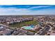 Community swimming pool with ample parking, landscaping, shade structures, and open green space at 4323 E Wheaton St, Gilbert, AZ 85295