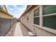 Well maintained backyard showcasing an intimate walkway with ambient lighting and mature landscaping at 4323 E Wheaton St, Gilbert, AZ 85295