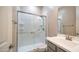 Bathroom featuring a glass-enclosed shower and modern vanity with a sink at 4323 E Wheaton St, Gilbert, AZ 85295