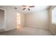 Bright bedroom with neutral walls and carpet, featuring access to the bathroom at 4323 E Wheaton St, Gilbert, AZ 85295