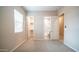Bedroom featuring two doors, carpeted floor, and neutral colors at 4323 E Wheaton St, Gilbert, AZ 85295