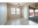Bright dining area featuring natural light, sliding glass door, and tiled flooring, perfect for indoor-outdoor dining experiences at 4323 E Wheaton St, Gilbert, AZ 85295