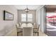 Elegant dining room featuring a wooden table with seating for six, complemented by modern decor and natural lighting at 4323 E Wheaton St, Gilbert, AZ 85295