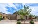 Inviting single-Gathering house boasts manicured landscaping, a paved driveway, and a two-car garage at 4323 E Wheaton St, Gilbert, AZ 85295